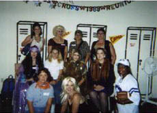 A group photo from the One Of The Girls party with the mural party decoration