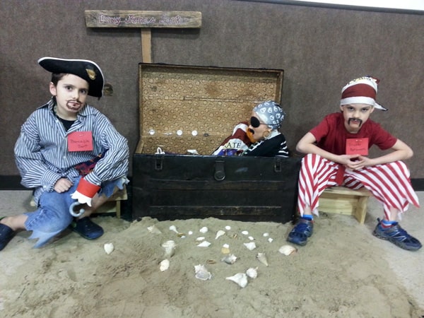 Photo of teen boys playing pirates at teenage birthday parties